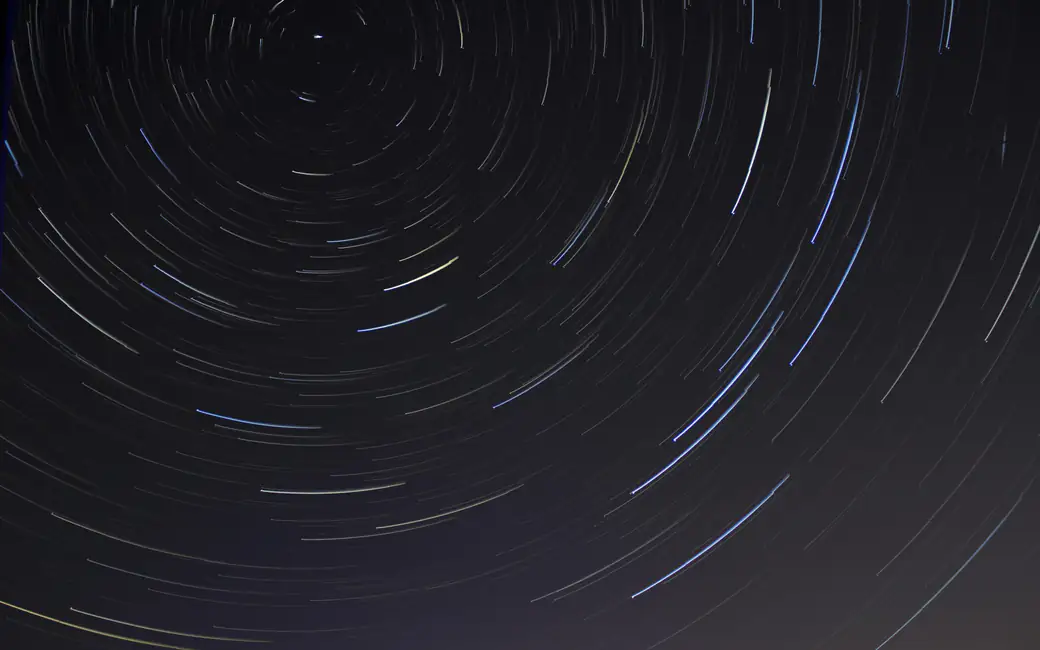Circular trails of stars in the sky — desktop and phone wallpaper, free download