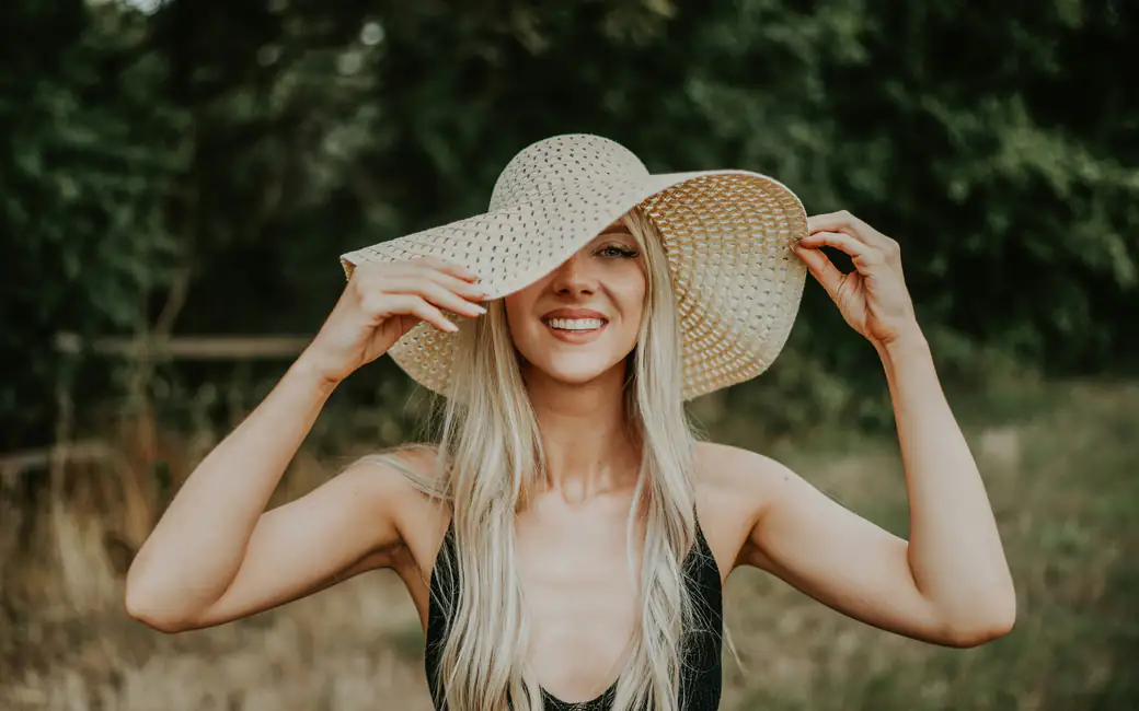 Blonde Woman Wearing Large Sun Hat — desktop and phone wallpaper, free download