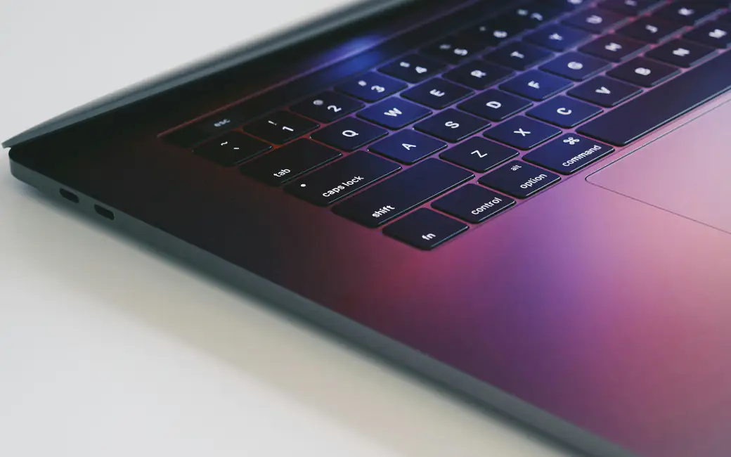 MacBook in the color midnight — desktop and phone wallpaper, free download