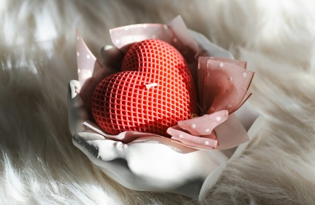 A Lovely Red Heart Candle in Elegant Setting