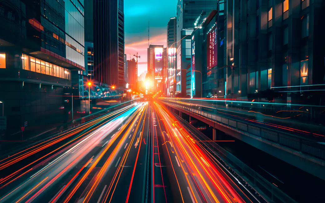 Urban light trails on city highway — desktop and phone wallpaper, free download