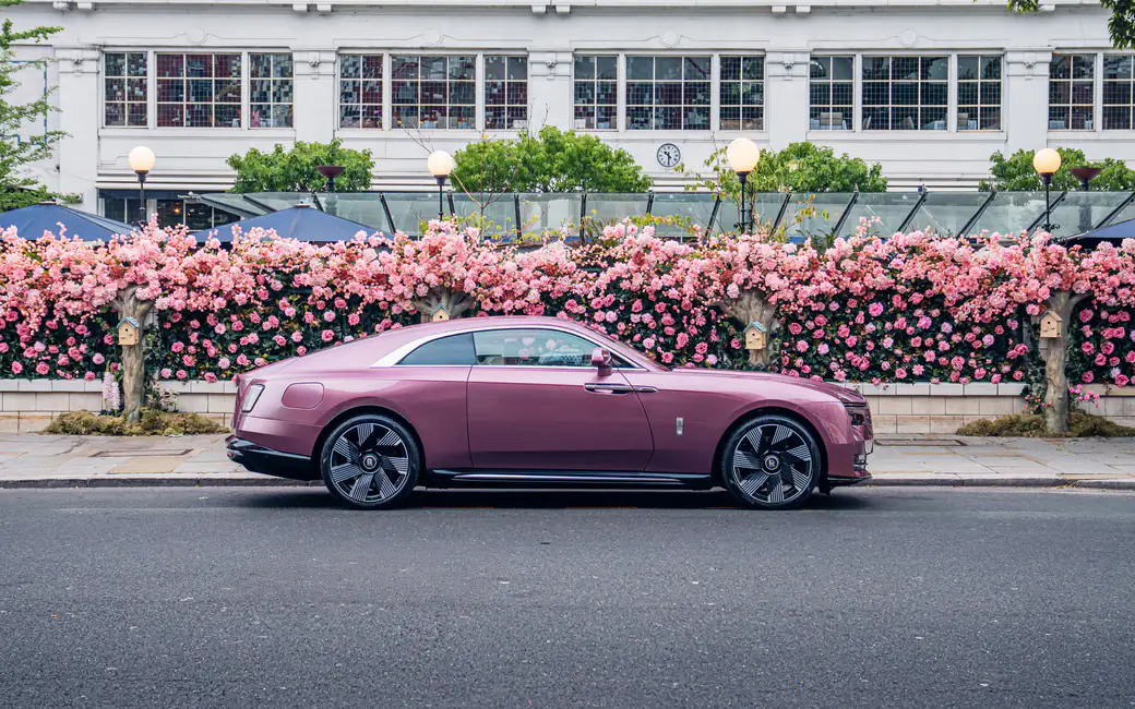 Pink Rolls-Royce Spectre on the side — desktop and phone wallpaper, free download