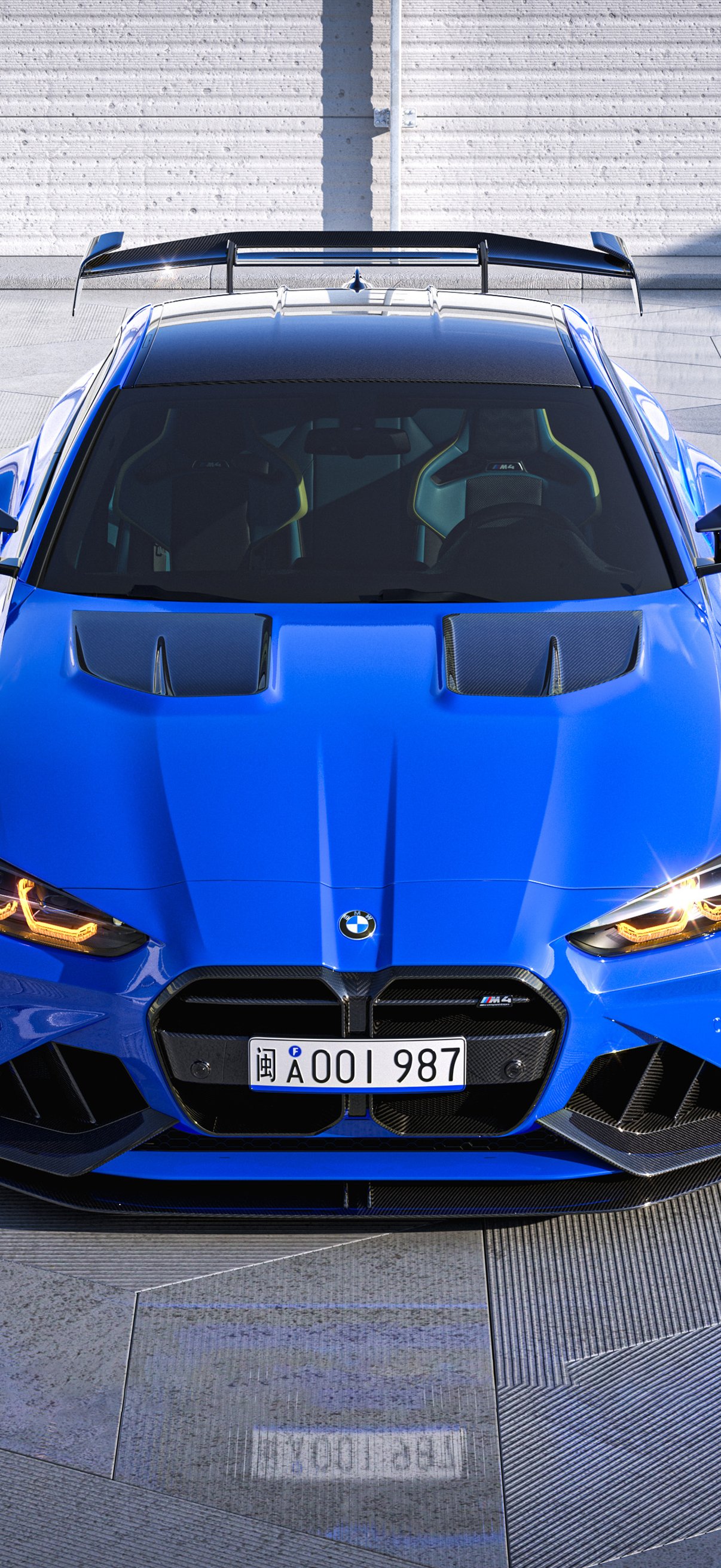 Blue BMW M4 G82 front view in - Wallpapers for iPhone 17 Pro/17/16 Pro in 1206x2622 resolution