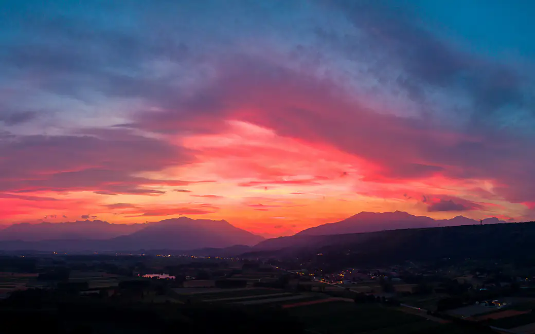 Bright red sunset in the mountains — desktop and phone wallpaper, free download