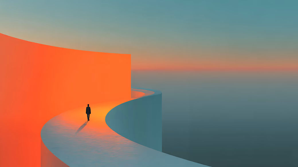 Man walking on curved path at sunset — desktop and phone wallpaper, free download
