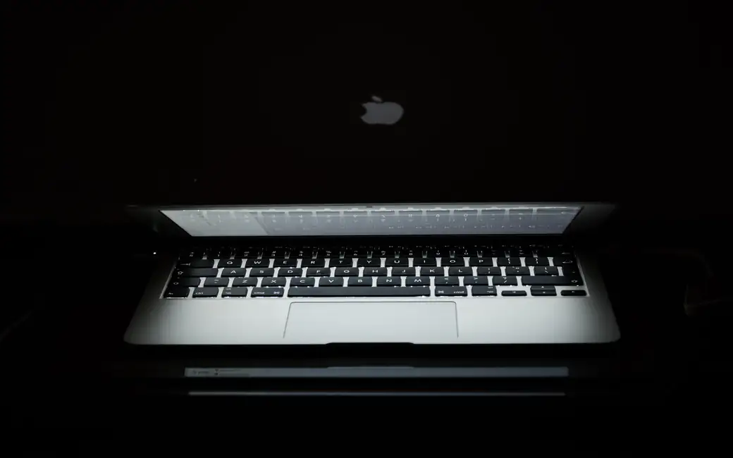 MacBook with a bright backlight — desktop and phone wallpaper, free download