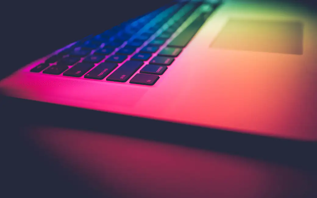 MacBook Pro with color backlight — desktop and phone wallpaper, free download