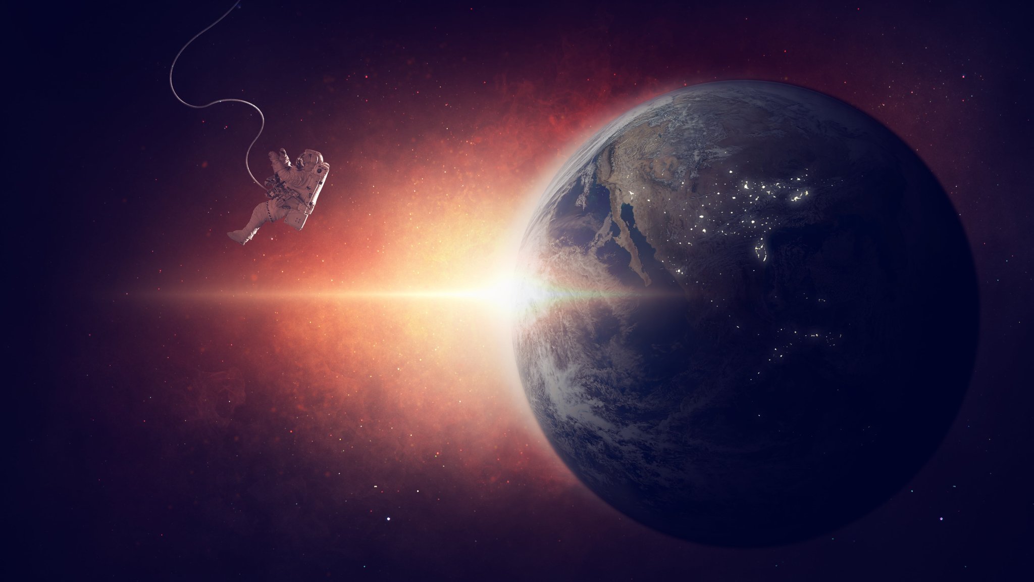 Astronaut in outer space orbiting the Earth - QWXGA wallpapers in 2048x1152 resolution