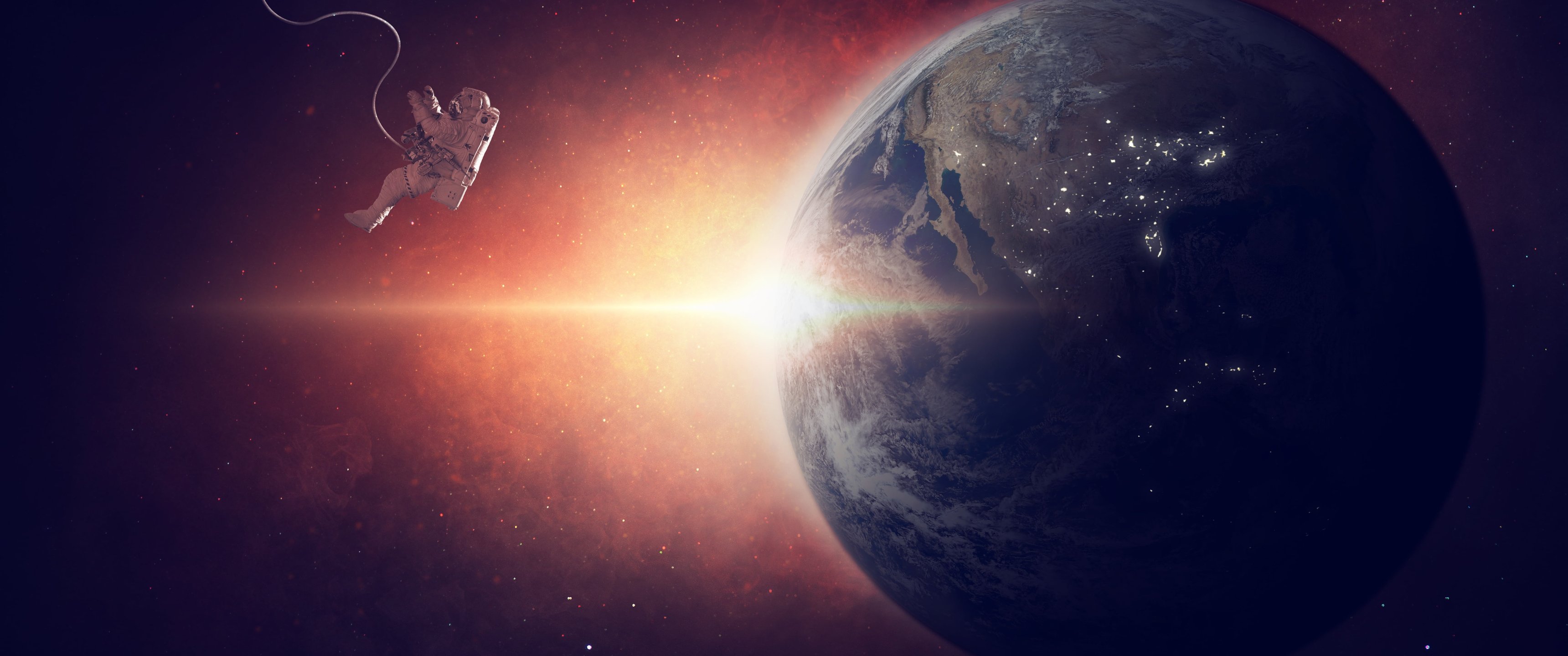 Astronaut in outer space orbiting the Earth - UltraWide 21:9 wallpapers in 3440x1440 resolution
