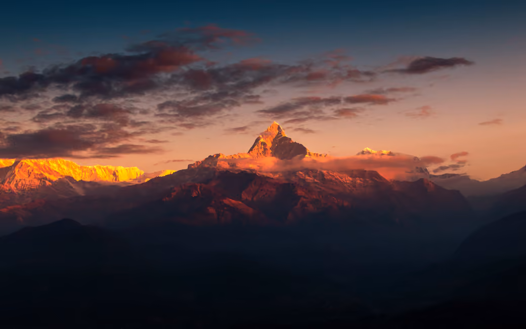 Orange sunset in the Himalayas — desktop and phone wallpaper, free download