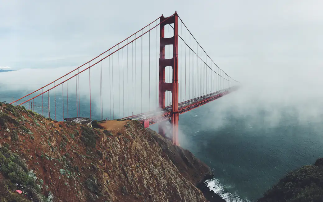 Fog hides the Golden Gate Bridge — desktop and phone wallpaper, free download