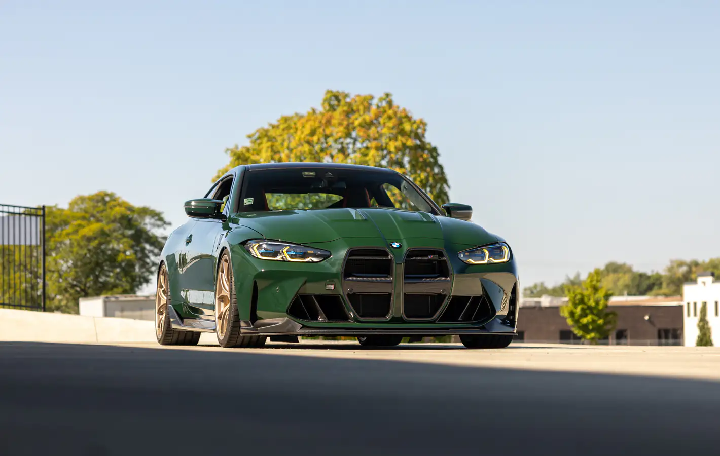 BMW M4 G82 with gold wheels — desktop and phone wallpaper, free download