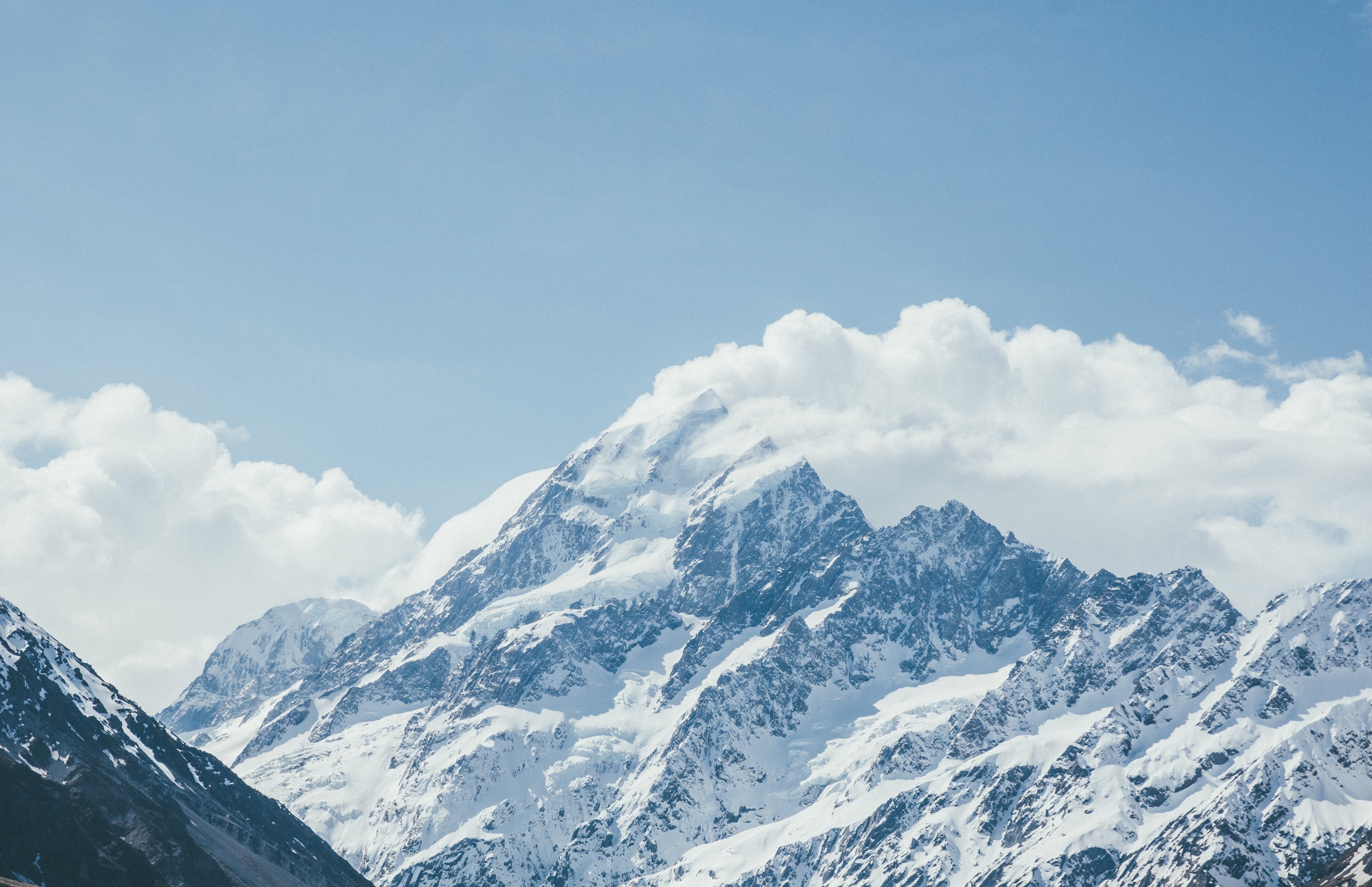 Snowy Mountain Peaks with Cloud Cover - Wallpapers for Apple MacBook 16.2″ in 3456x2234 resolution