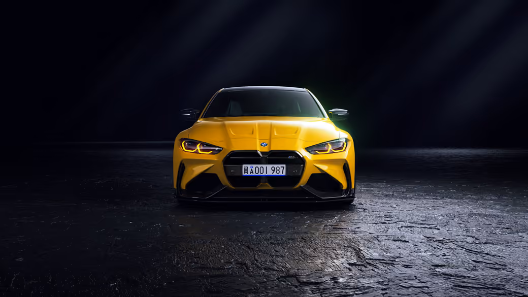 Yellow BMW M4 G82 front view — desktop and phone wallpaper, free download