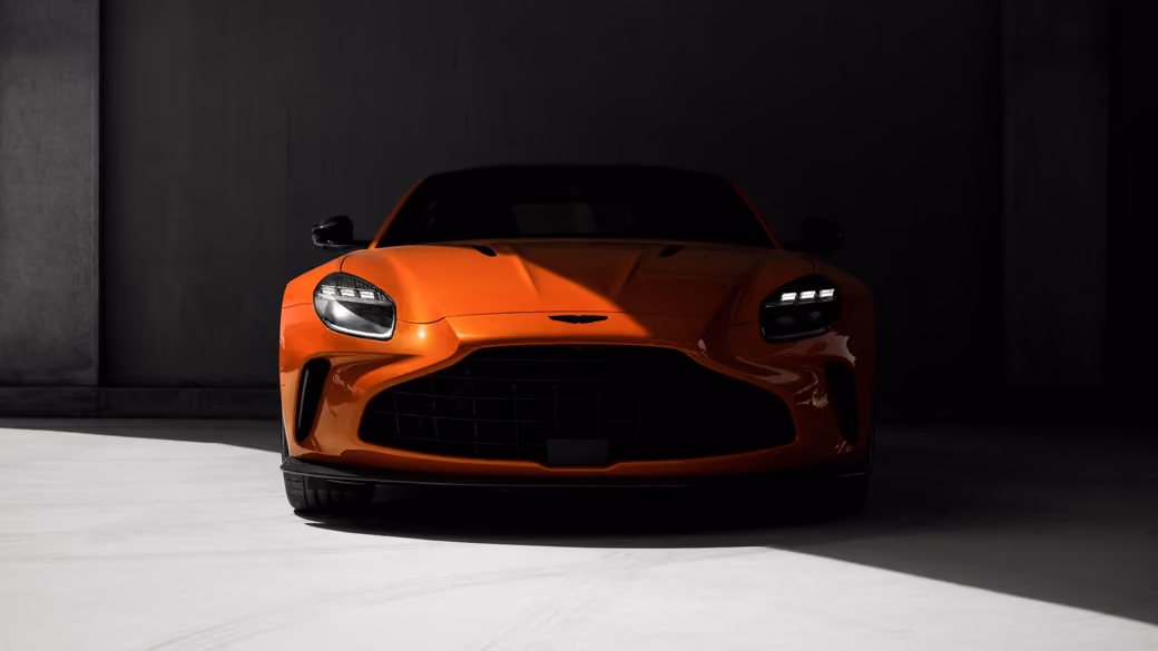 Aston Martin Vantage Middle East in dramatic lighting — desktop and phone wallpaper, free download