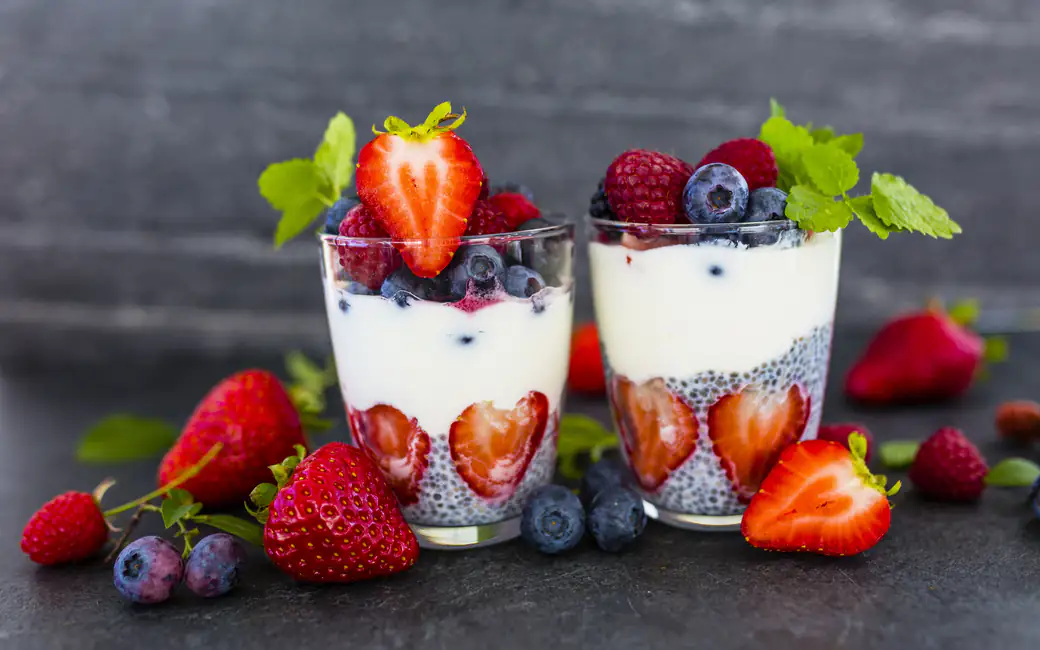 Two berry parfaits with berries — desktop and phone wallpaper, free download
