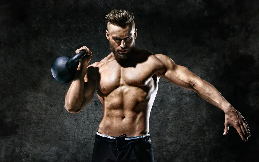 Manly man trains with a kettlebell — desktop and phone wallpaper, free download