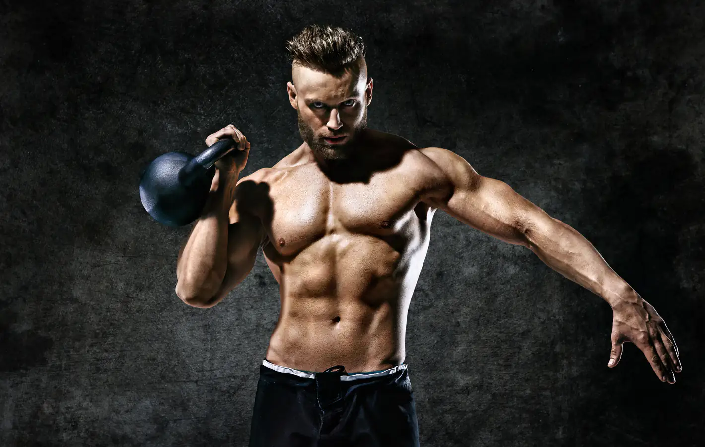 Manly man trains with a kettlebell — desktop and phone wallpaper, free download