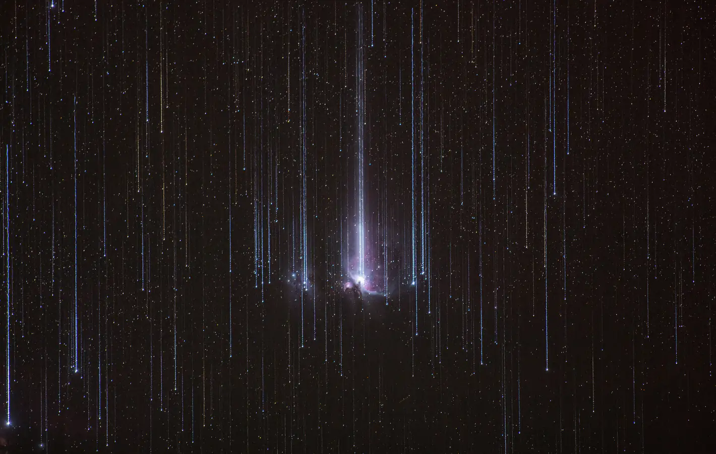 Traces of stars on the background of a galaxy — desktop and phone wallpaper, free download