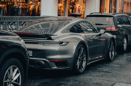 Luxury gray sports car parked on city street