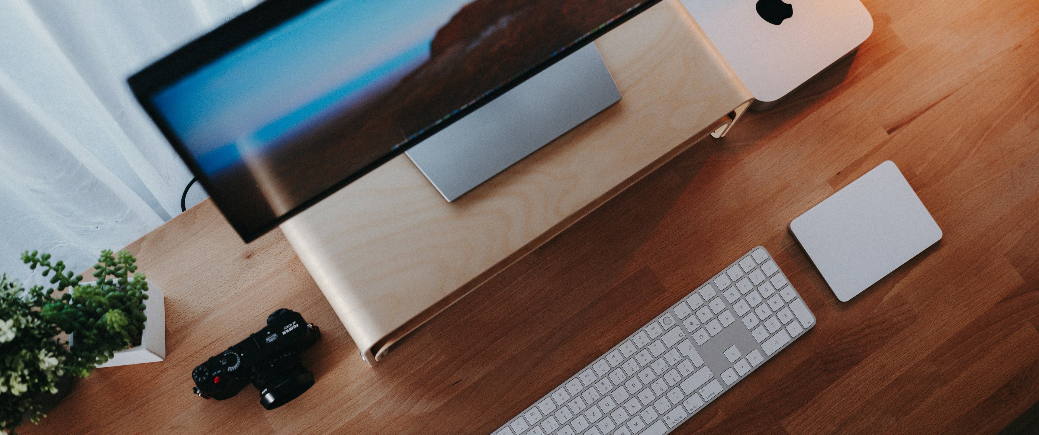 Modern workspace with Apple computer setup - UltraWide 21:9 wallpapers in 3440x1440 resolution