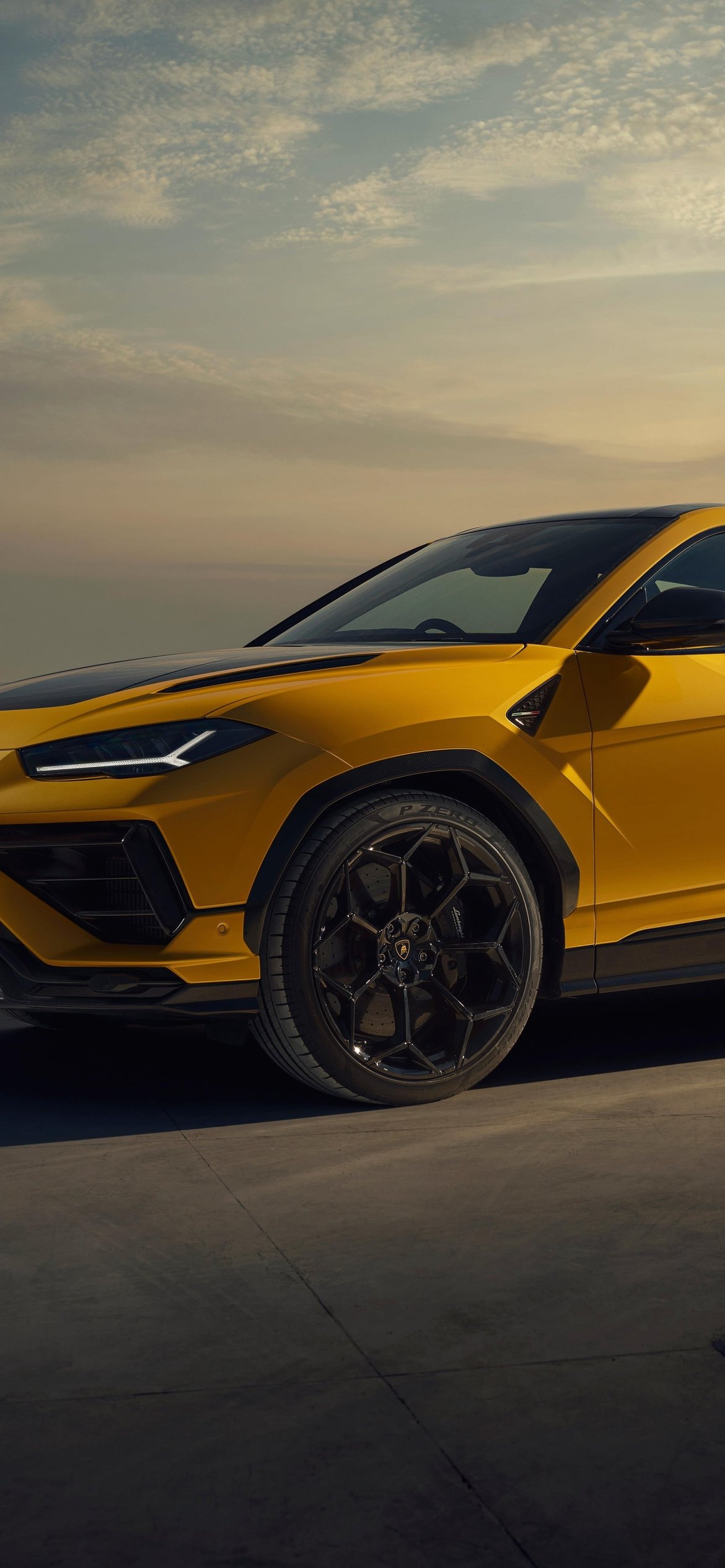 Yellow Lamborghini Urus at Sunset - Wallpapers for iPhone 12 Pro/13 Pro/14 in 1170x2532 resolution