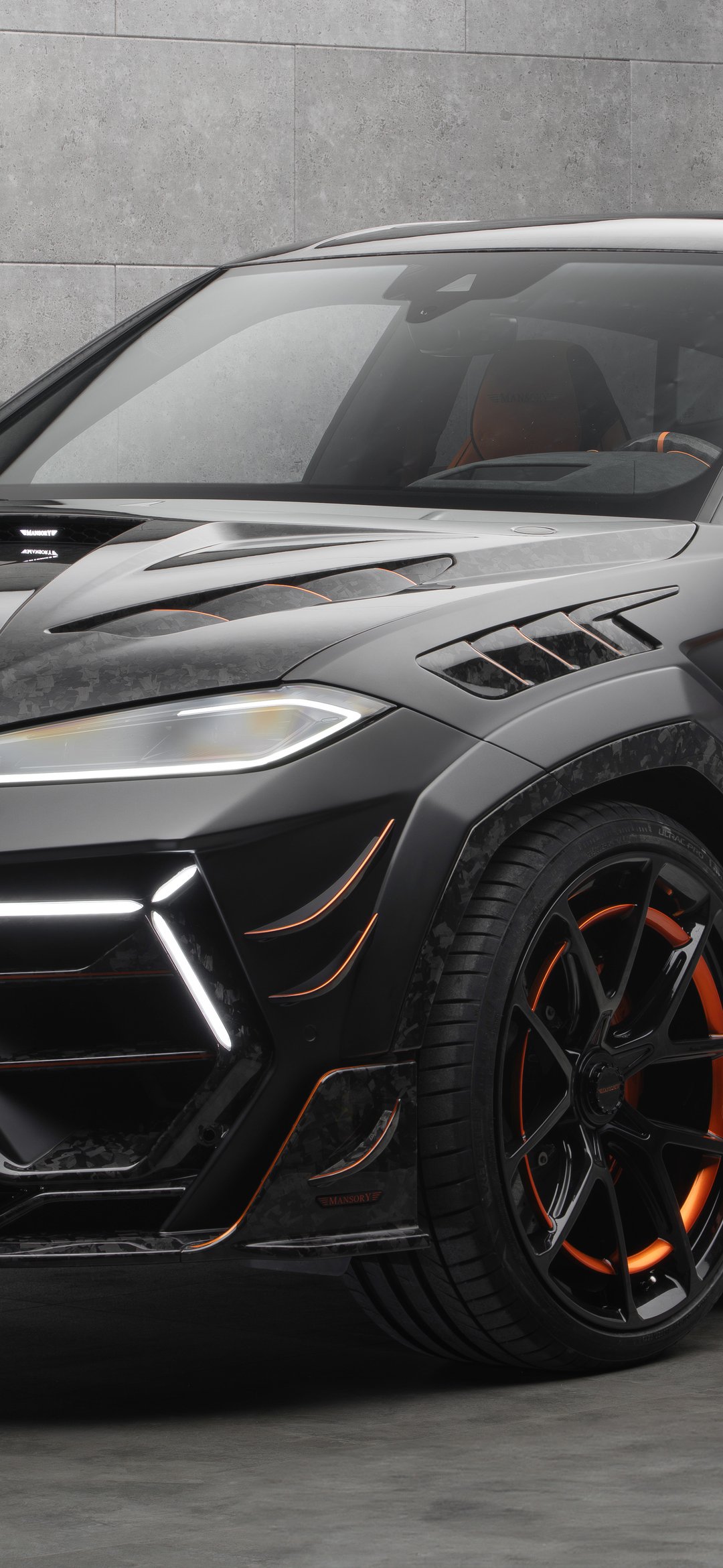 Lamborghini Urus SE in tuning Mansory Venatus - Wallpapers for iPhone 12 mini/13 mini, Samsung Galaxy S24/S24 FE/S25/S25 FE/S26/A55/A56/A35/A26/A16/M15, Xiaomi, Sony Xperia in 1080x2340 resolution