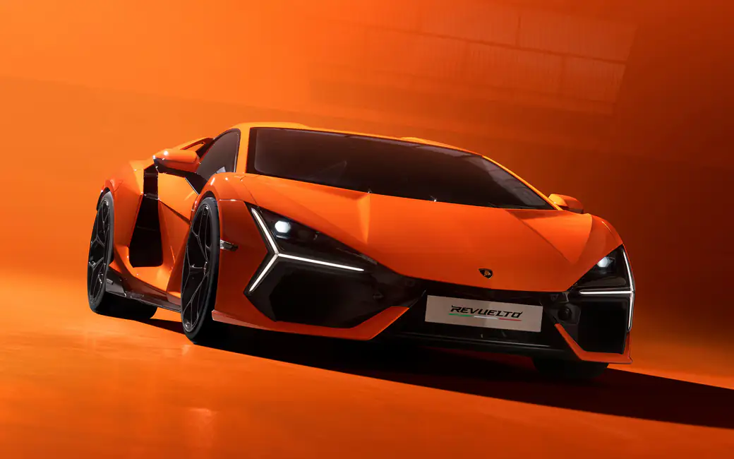 Bright orange Lamborghini Reventon front — desktop and phone wallpaper, free download