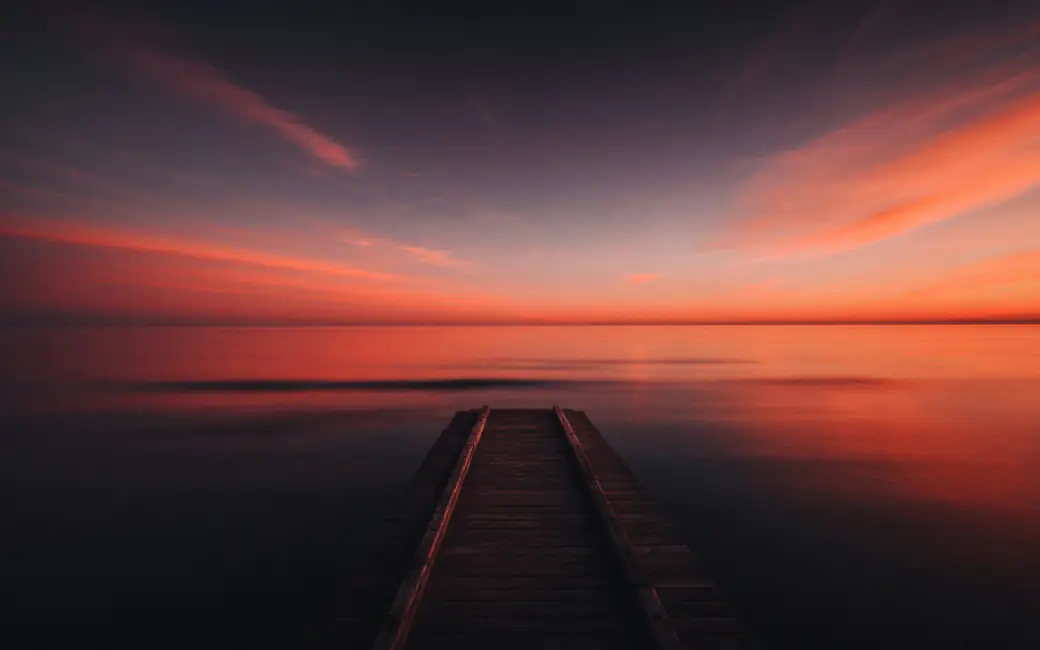 Red Sunset Over Calm Sea — desktop and phone wallpaper, free download