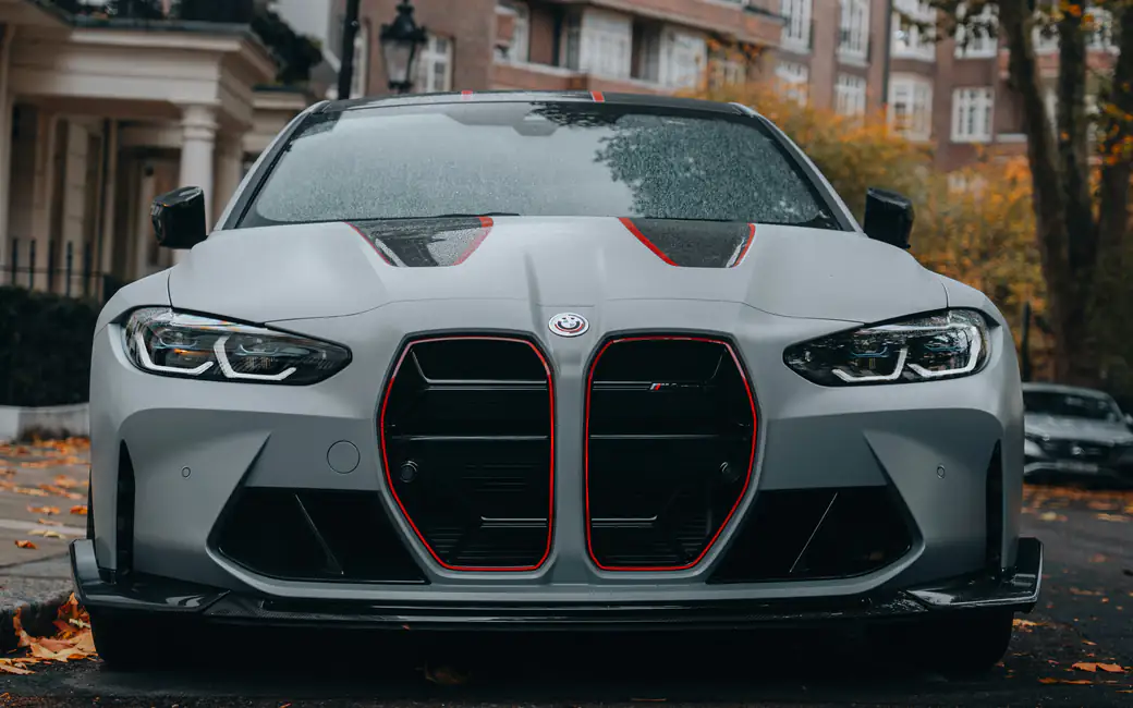 Gray BMW M4 CSI on Autumn Street — desktop and phone wallpaper, free download