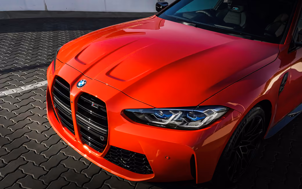 Red BMW M4 Competition Front View — desktop and phone wallpaper, free download