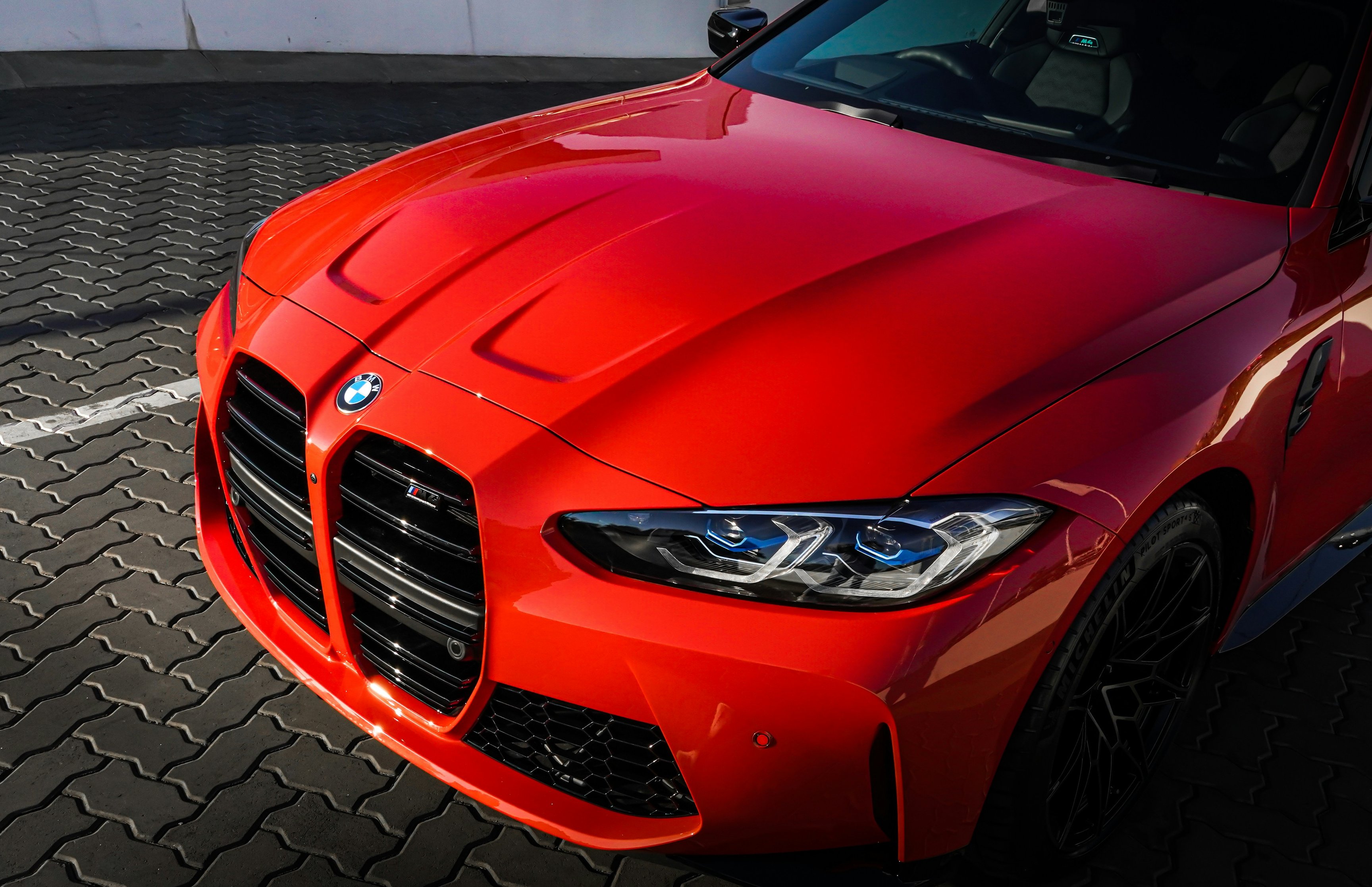 Red BMW M4 Competition Front View - Wallpapers for Apple MacBook 16.2″ in 3456x2234 resolution