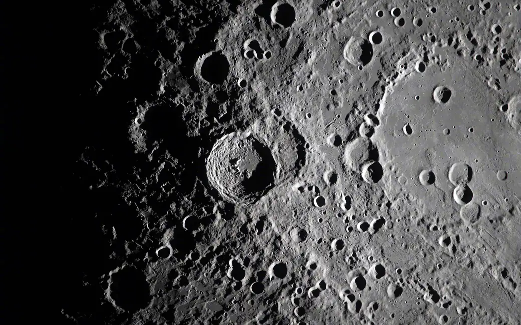Close-up of the Moon's surface — desktop and phone wallpaper, free download