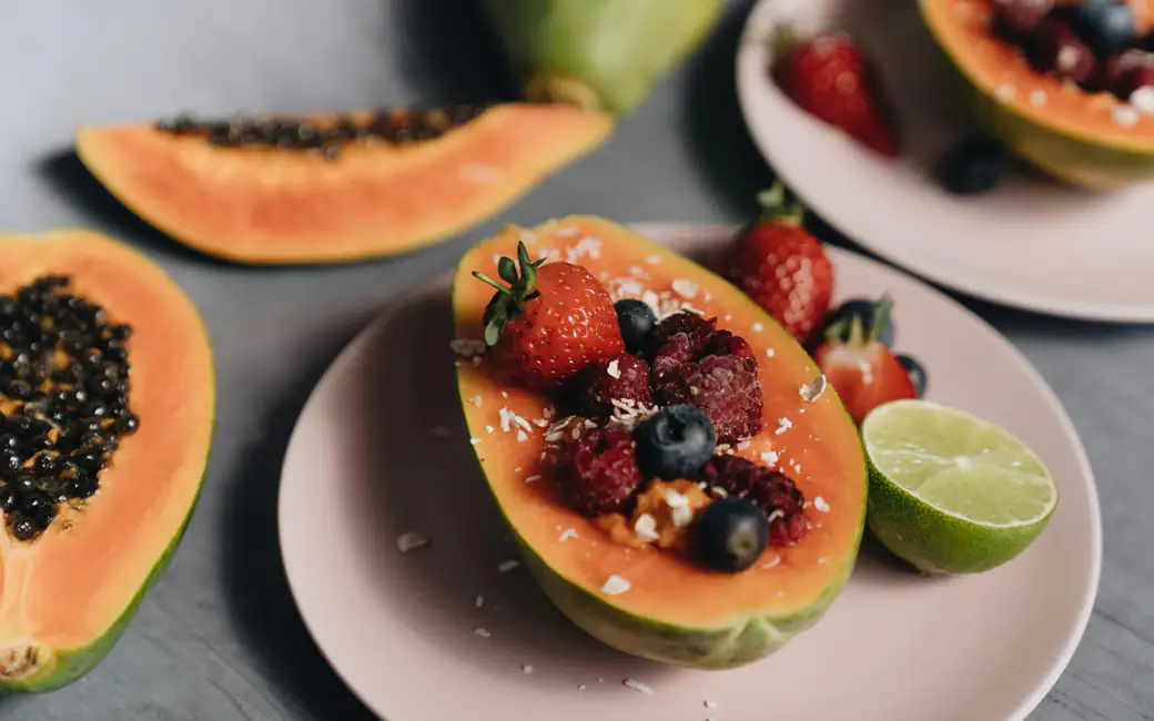 Papaya bowl with fresh berries — desktop and phone wallpaper, free download