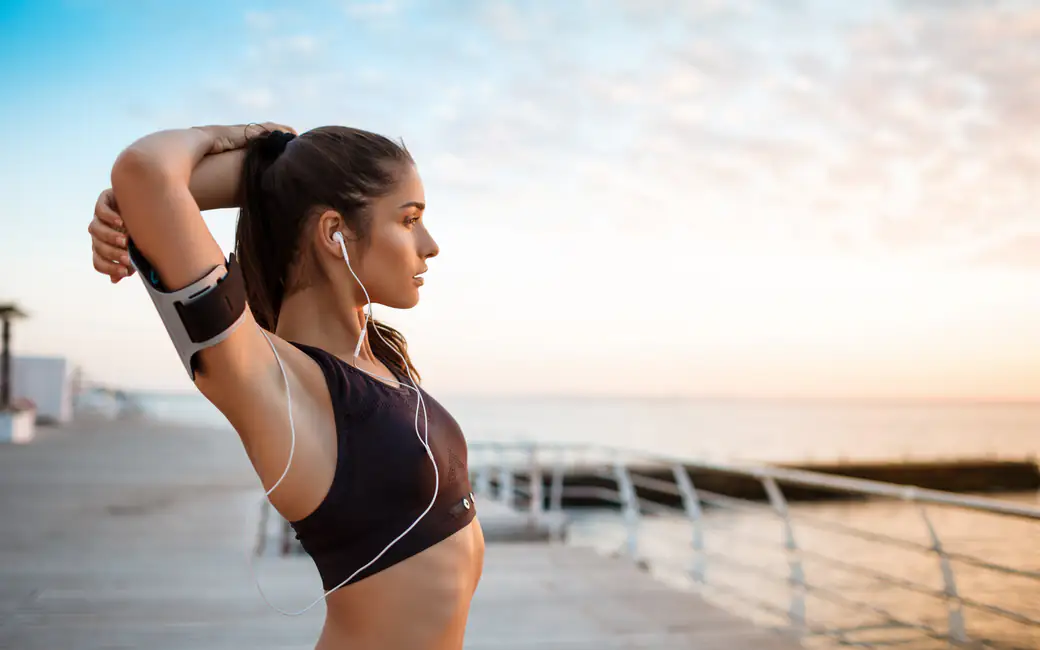 Girl at a fitness workout by the sea — desktop and phone wallpaper, free download
