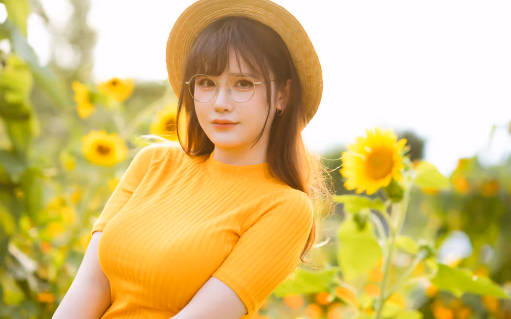 Asian Rissoft model in a field of sunflowers — desktop and phone wallpaper, free download