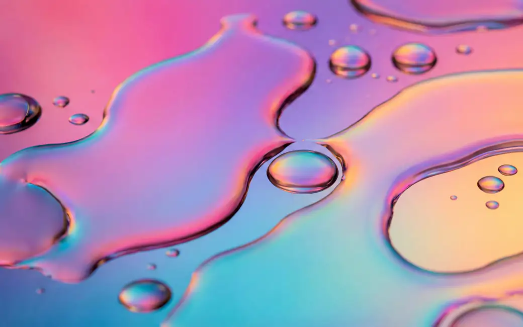 Rainbow liquid in the macro — desktop and phone wallpaper, free download