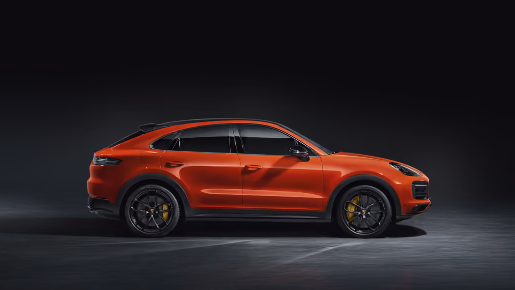 Orange Porsche Cayenne Coupe SUV — desktop and phone wallpaper, free download