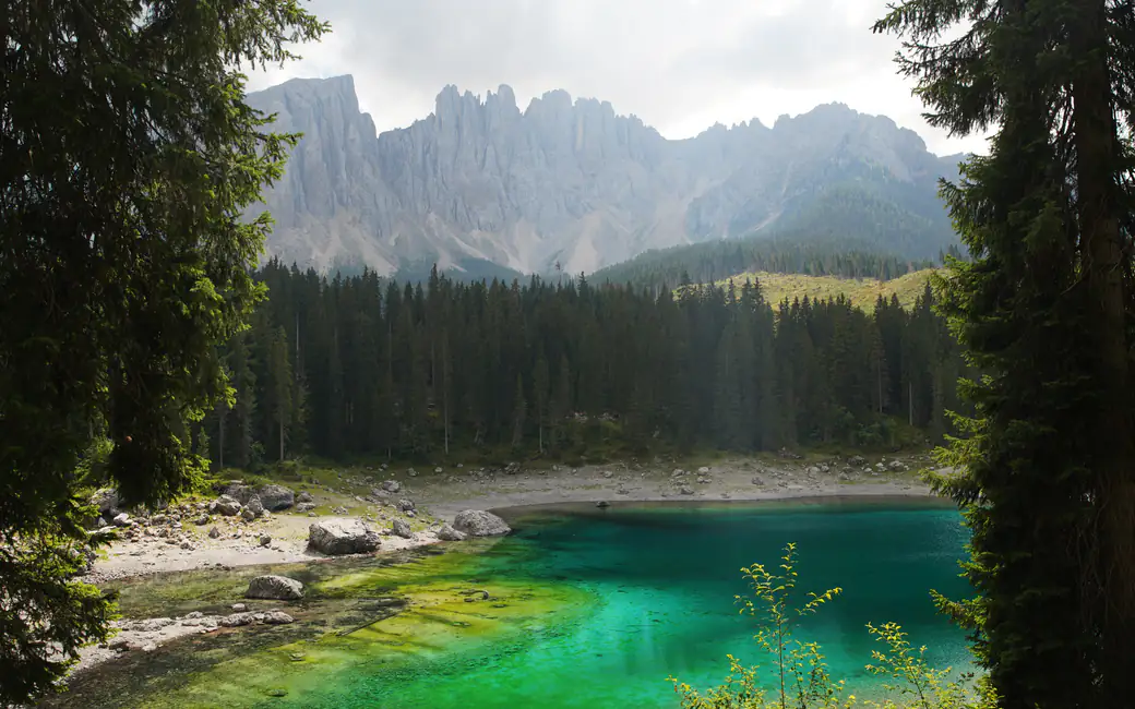Turquoise Lake Karezza in the Dolomites — desktop and phone wallpaper, free download