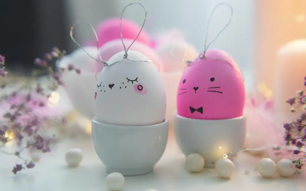 Easter eggs decorated as cute bunnies — desktop and phone wallpaper, free download