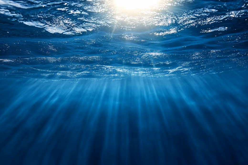 Underwater Ocean Waves with Sunlight — desktop and phone wallpaper, free download