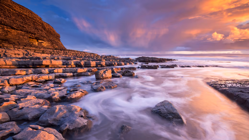 Sunset at Nash Point Coastline — desktop and phone wallpaper, free download
