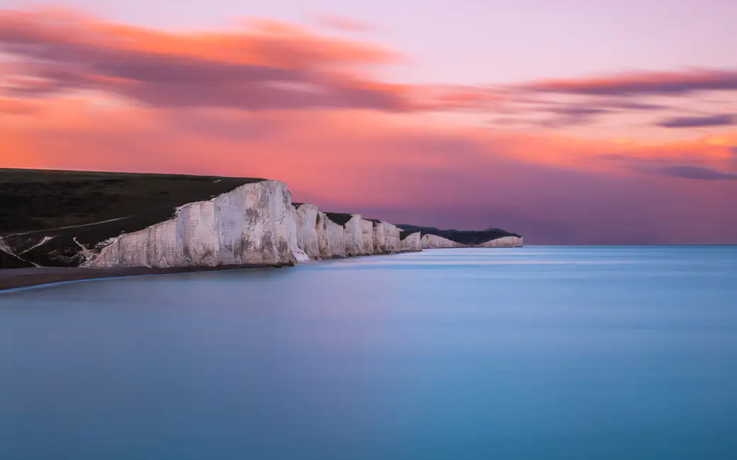 Sunset over Englands Coastal Cliffs — desktop and phone wallpaper, free download