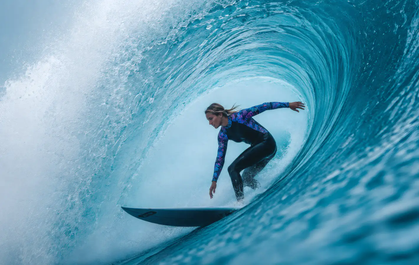 Blonde Surfer Inside an Ocean Wave — desktop and phone wallpaper, free download