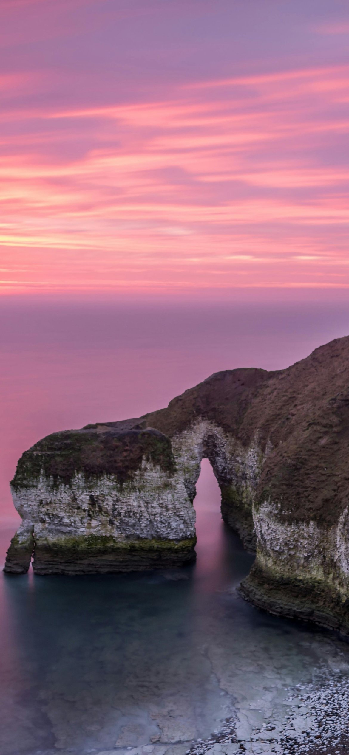 Drinking Dinosaur Rock at Sunset - Wallpapers for iPhone 12 Pro/13 Pro/14 in 1170x2532 resolution