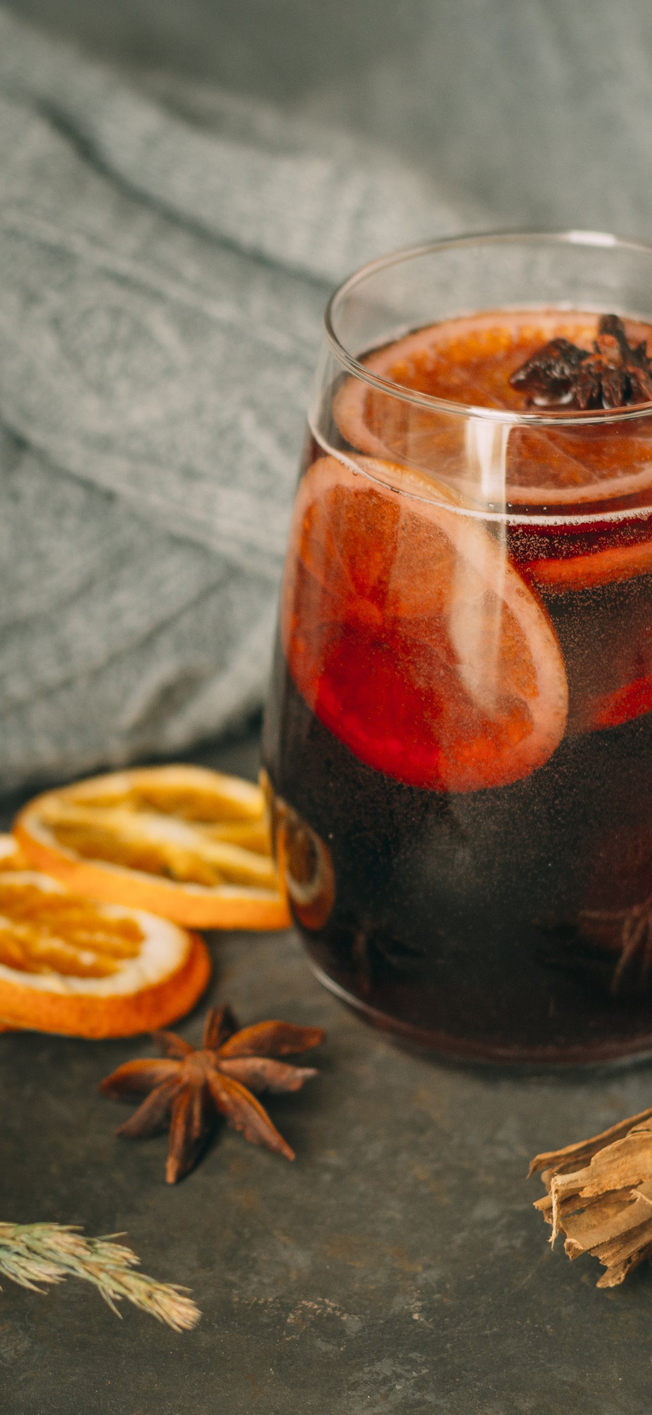 Warm mulled wine in a clear glass - Wallpapers for iPhone 15 Pro Max/14 Pro Max in 1290x2796 resolution
