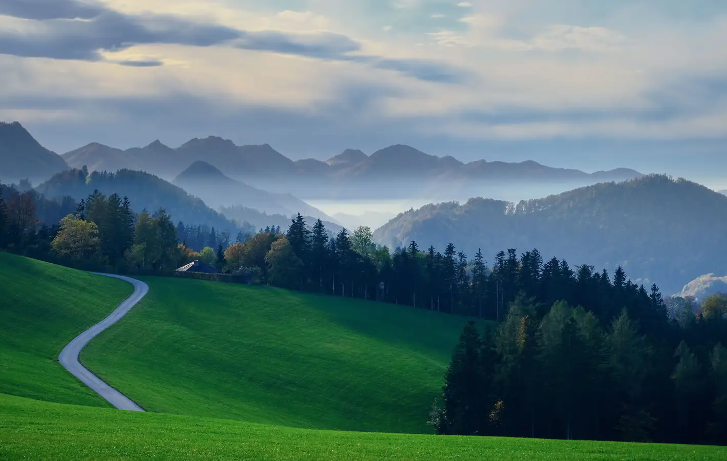 Flat green field and hills — desktop and phone wallpaper, free download