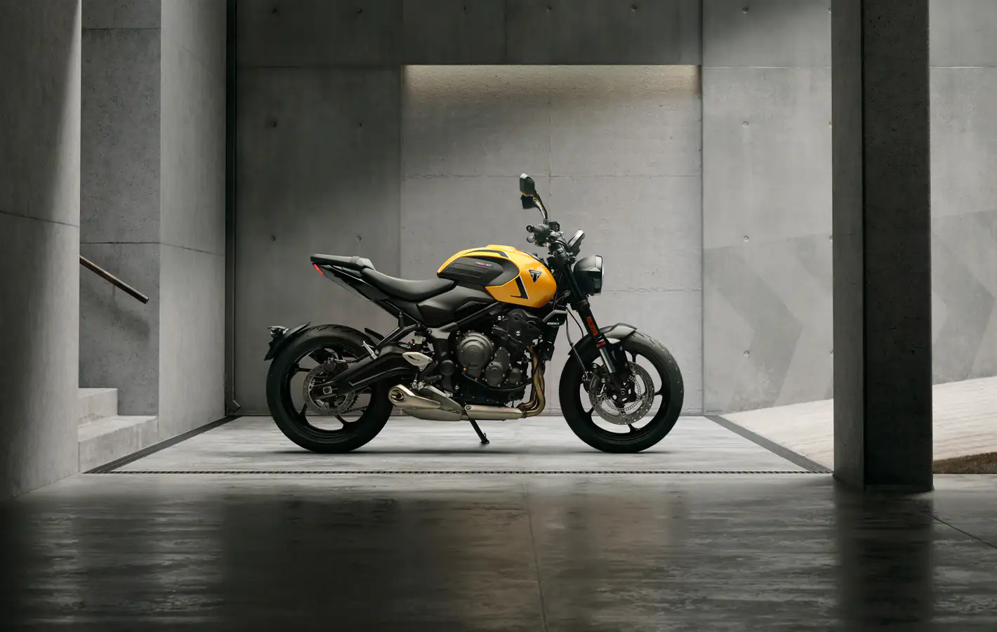 Triumph Trident 660 motorcycle in the garage — desktop and phone wallpaper, free download