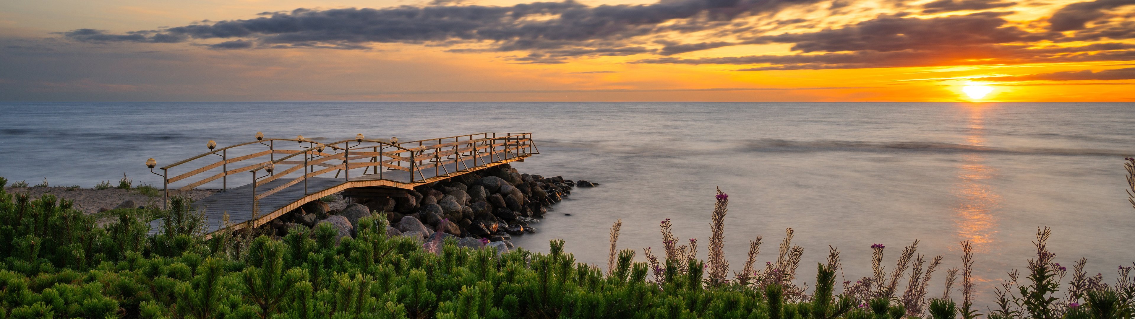 Sunset Coast with Wooden Bridge - UltraWide 32:9 wallpapers in 3840x1080 resolution