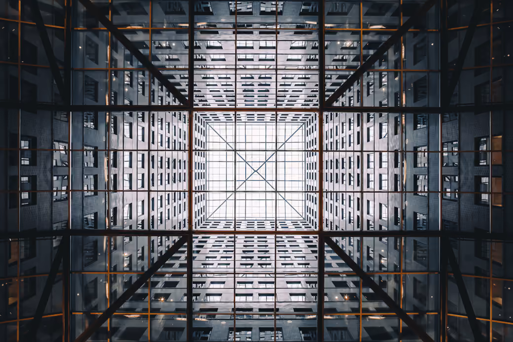 Symmetric Glass Skyscraper Facade — desktop and phone wallpaper, free download